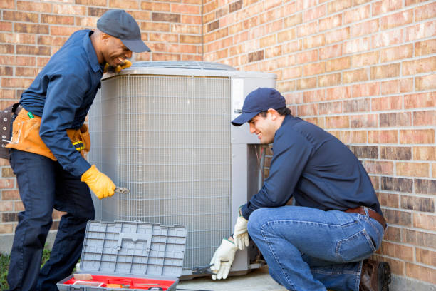 HVAC team installing air conditioning unit